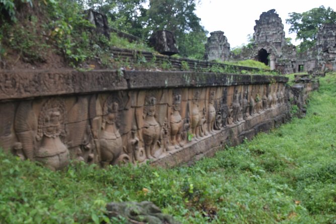 2-D Angkor temple tour with one sunrise in A/C vehicle and guide. - Angkor Thom and the Victory Gate: a gate you’ll remember