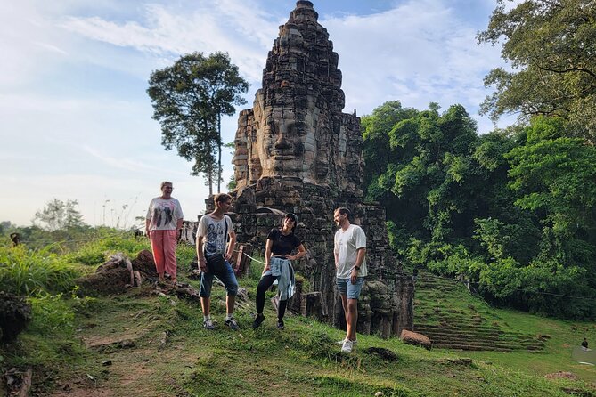 2 Day Angkor Wat Kulen Mountain Beng Mealea Floating Village Tour - Day 1: Angkor Wat to Ta Prohm to Angkor Thom (the temple trilogy)