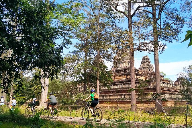 Angkor Sunrise Bike Tour - Breakfast & Lunch included - Stop 2: Angkor Thom’s South Gate—where the carvings set the mood