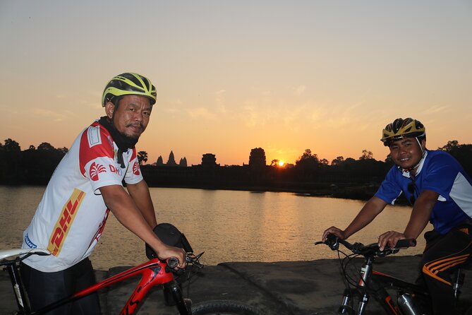Angkor Sunrise Expedition Cycling Through Serene Backroads - Angkor Thom Wall Cycling: Moat on One Side, Jungle on the Other