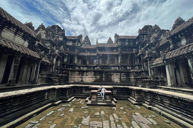 Angkor Wat Bike Tour with Lunch Included - Angkor Thom and Bayon: smiling stone heads and a political view of religion