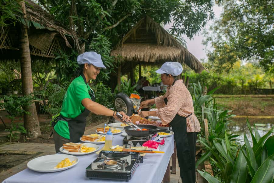 Angkor Wat: Guided Sunrise Bike Tour w/ Breakfast and Lunch - Cycling behind Angkor Wat: village tracks, low-traffic roads, and real life