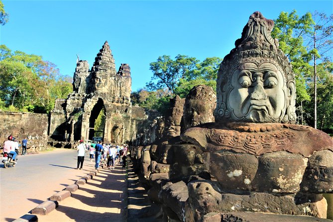 Angkor Wat Highlights and Sunrise Guided Tour from Siem Reap - Bayon and Angkor Thom: 200 faces, capital-city feeling, and the south gate pause