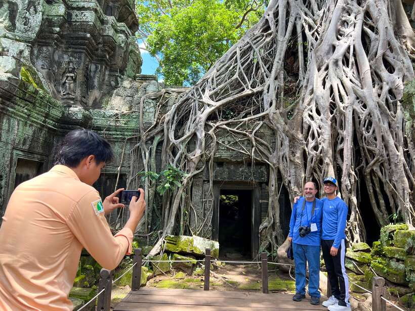 From Siem Reap: Angkor Wat Sunrise and Temples E-Bike Tour - Bayon and Victory Gate at Angkor Thom: Why the Smiling Faces Matter