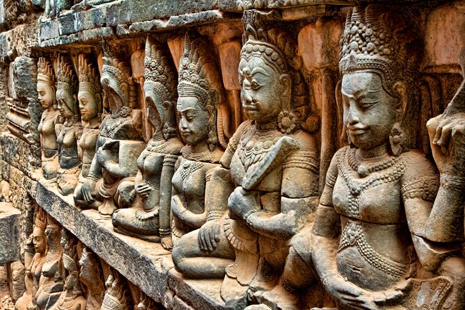 One Day Private Guide Tour of Angkor Thom, Bayon, Ta Phrom & Angkor Wat - Ta Prohm: dark sandstone, gray courtyards, and the feeling of mystery