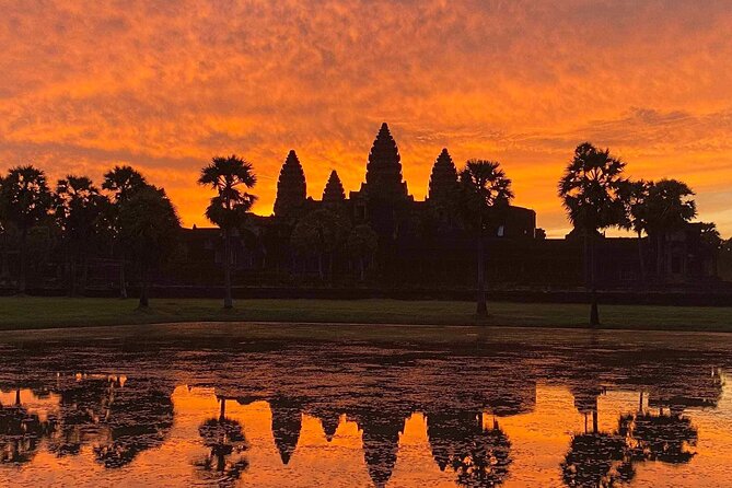 Private sunrise 'small tour' of Angkor Wat with car or van & Guide - Stop 5: Angkor Thom, South Gate gods-and-demons, and Bayon faces