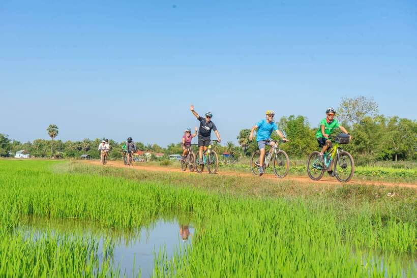 Siem Reap: Angkor Sunrise 2 Days Guided Bike Tour - Day 2 countryside cycling: rice fields, markets, lotus and mushroom farms, and rice wine areas
