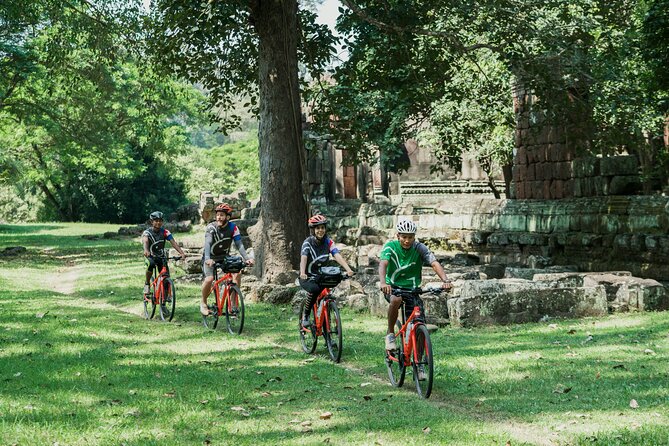 Siem Reap: Angkor Wat Sunrise Bike Tour & Jungle Breakfast - Ta Prohm: The Tomb Raider Temple and the Roots Through Stone