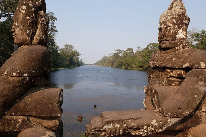Sunrise in Angkor and Banteay Srei Private Tour - Angkor Wat at dawn: pond reflections, carvings, and a smart pace